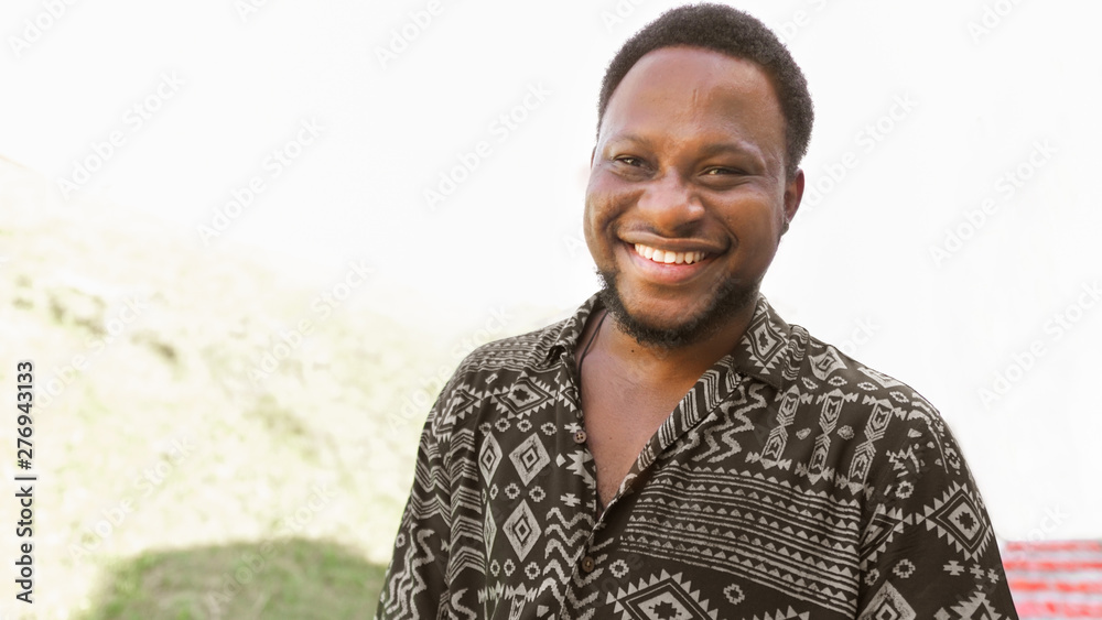 Close up portrait of a happy young african american man laughing. Close up portrait of a happy young african american man laughing.