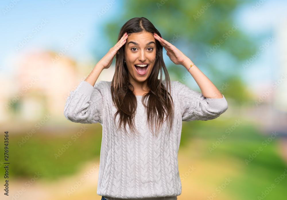 Young hispanic brunette woman with surprise expression at outdoors