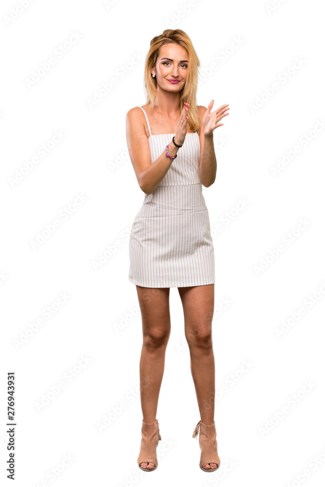 A full-length shot of a Young blonde woman applauding after presentation in a conference over isolated white background A full-length shot of a Young blonde woman applauding after presentation in a conference over isolated white background