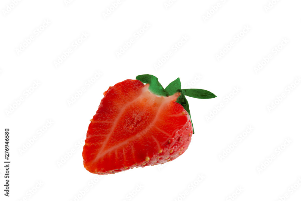 Half a strawberry on a white background close-up. Half a strawberry on a white background close-up.