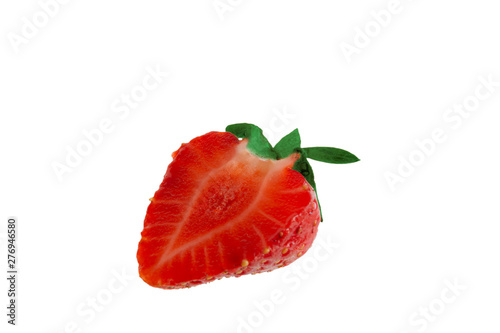 Half a strawberry on a white background close-up.