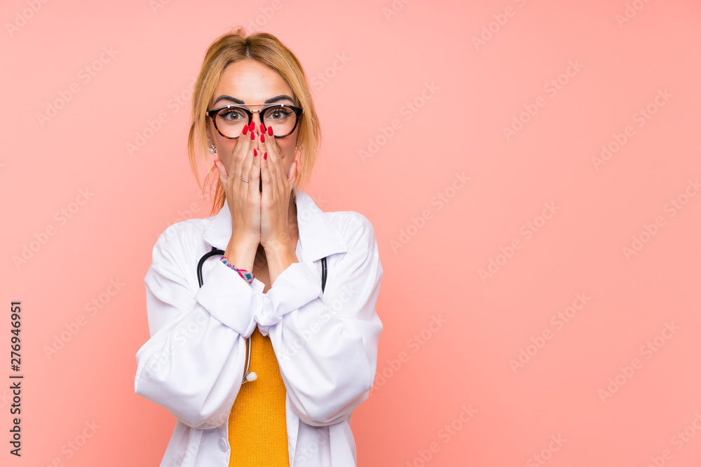 Young blonde doctor woman with surprise facial expression Young blonde doctor woman with surprise facial expression