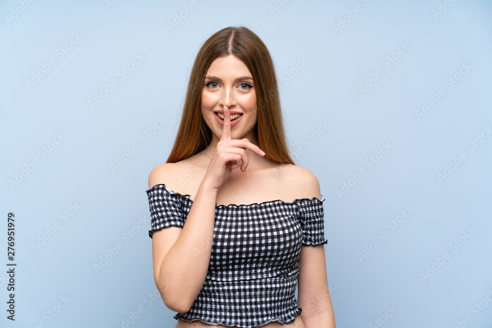 Young woman over isolated blue background doing silence gesture Young woman over isolated blue background doing silence gesture