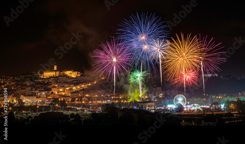 Panoramic view of the city of Coimbra, Portugal, with the firework show during the city festivities in 2019. © Luis Fonseca