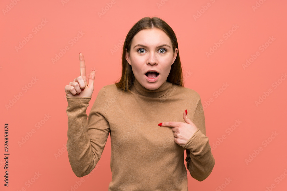 Young woman over colorful background with surprise facial expression Young woman over colorful background with surprise facial expression
