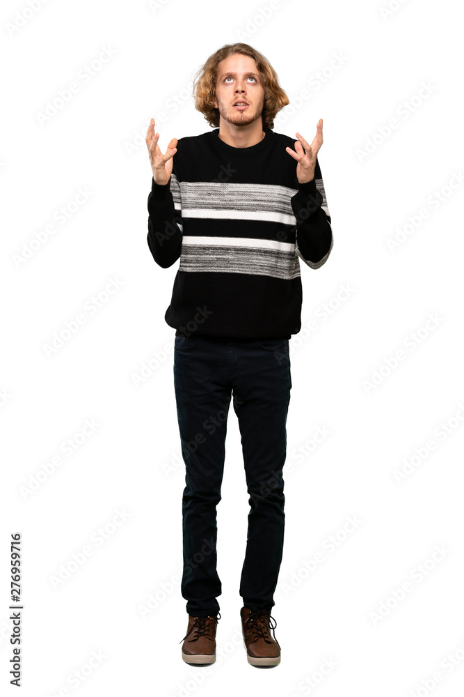 Full-length shot of Blonde man frustrated by a bad situation over isolated white background Full-length shot of Blonde man frustrated by a bad situation over isolated white background