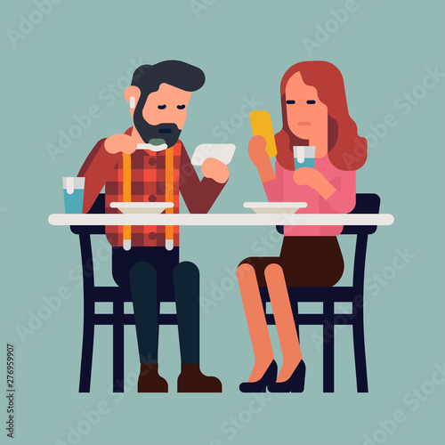 Couple with phones having a meal