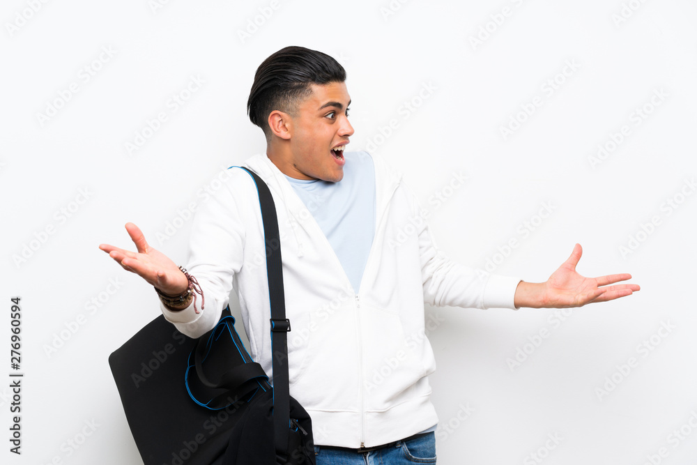Sport man over isolated white wall with surprise facial expression Sport man over isolated white wall with surprise facial expression