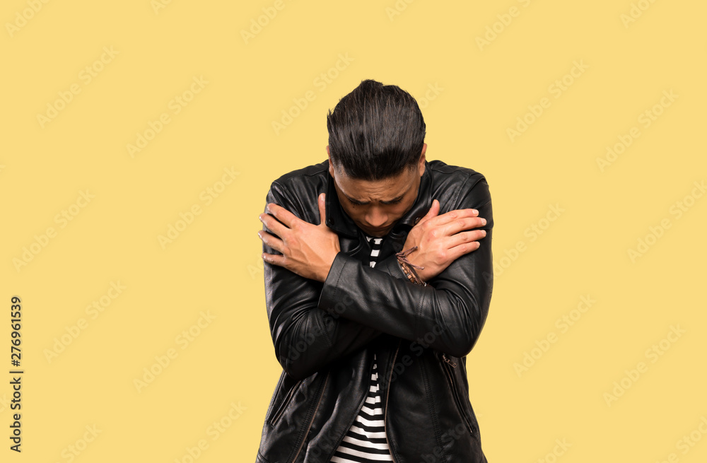 Young man freezing over isolated background Young man freezing over isolated background