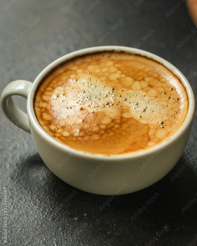 coffee freshly brewed in a white cup serving of beverage (coffee grain). food. top.copy save coffee freshly brewed in a white cup serving of beverage (coffee grain). food. top.copy save