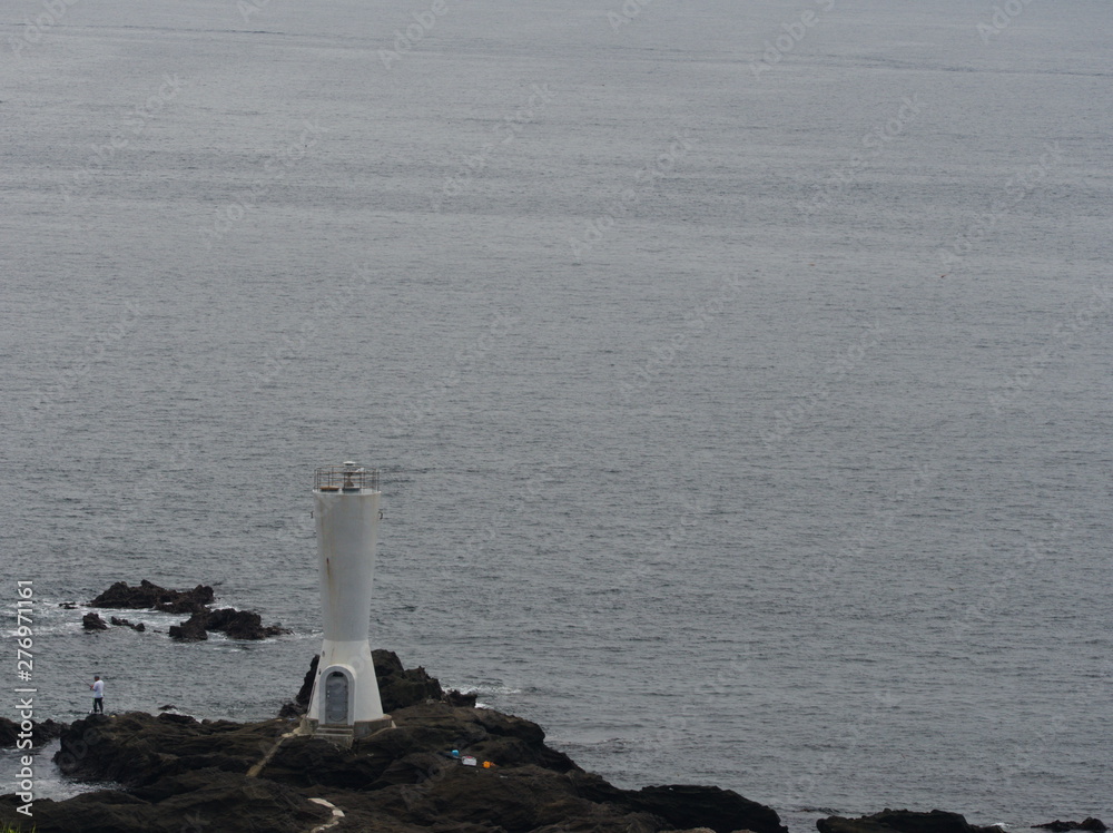 lighthouse on coast of sea