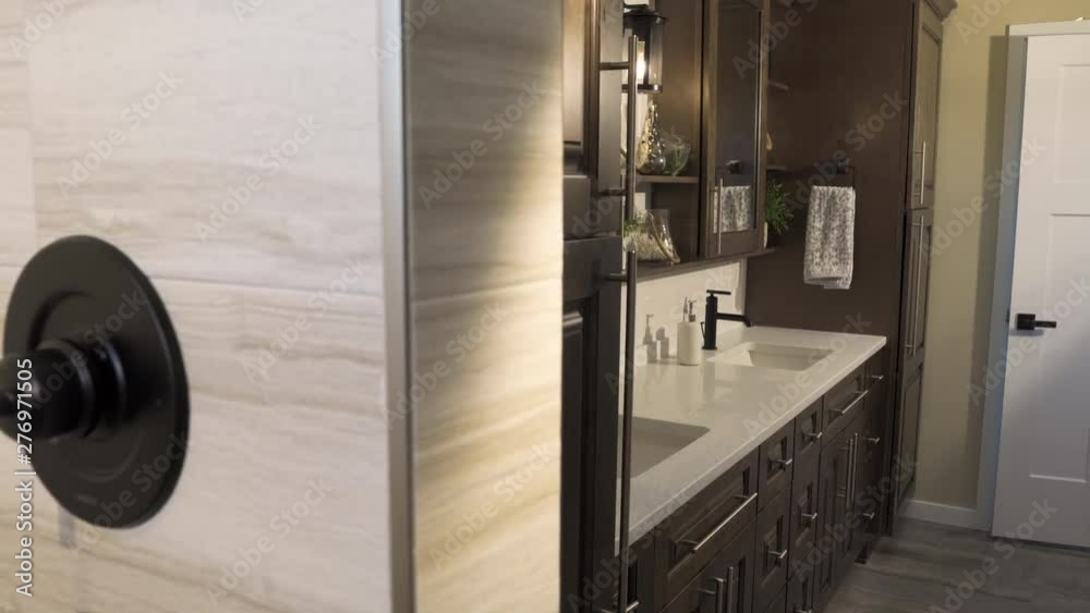 Master Bathroom Reveal from Shower Move Right. view moves right on a master bathroom scene revealing the double sink and vanity from the shower Master Bathroom Reveal from Shower Move Right. view moves right on a master bathroom scene revealing the double sink and vanity from the shower