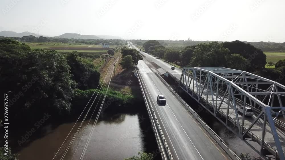 Aerial view of a stretch of the Pan-American Highway stretching across the countryside of rural central Panama. Aerial view of a stretch of the Pan-American Highway stretching across the countryside of rural central Panama.