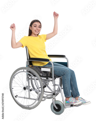 Happy young woman in wheelchair isolated on white