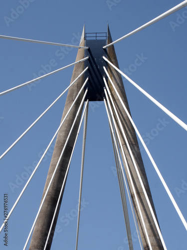 a view of the tower and cables on the marine way suspension bridge in southport merseyside against a blue summer sky © Philip J Openshaw 