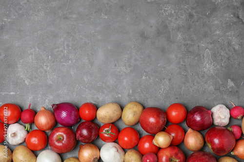 Ripe apples and vegetables on stone surface, flat lay. Space for text