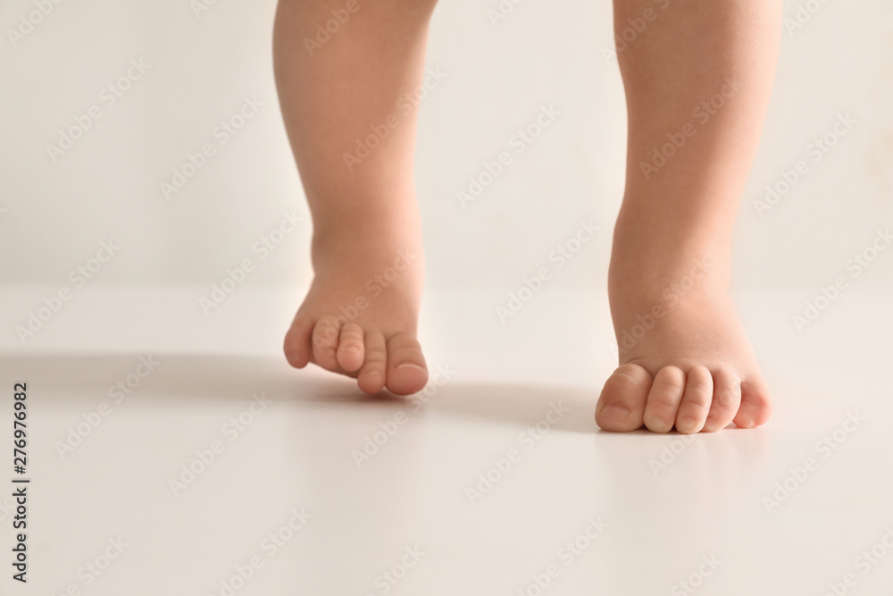 Little baby on light background, closeup on feet Little baby on light background, closeup on feet