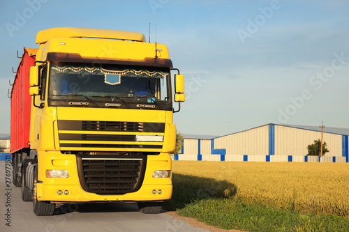 Modern truck on country road. Space for text