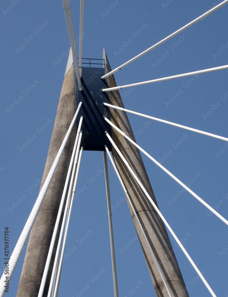 a view of the tower and cables on the marine way suspension bridge in southport merseyside against a blue summer sky a view of the tower and cables on the marine way suspension bridge in southport merseyside against a blue summer sky