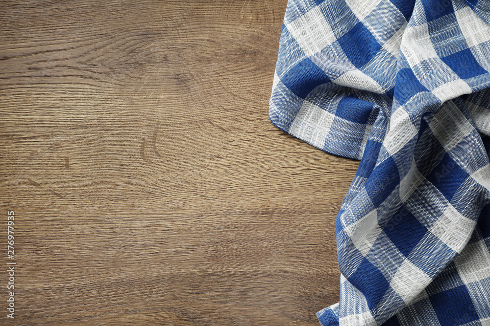 Kitchen towel on wooden table, top view. Space for text Kitchen towel on wooden table, top view. Space for text