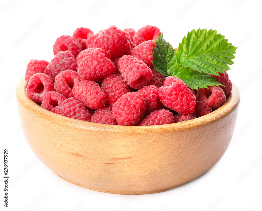 Bowl of delicious fresh ripe raspberries with leaves on white background Bowl of delicious fresh ripe raspberries with leaves on white background