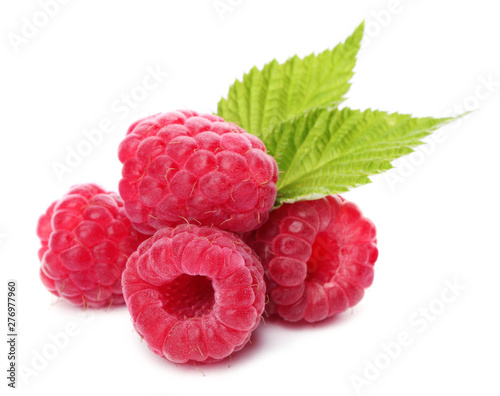 Delicious fresh ripe raspberries with leaves on white background