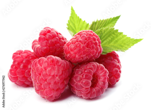 Delicious fresh ripe raspberries with leaves on white background