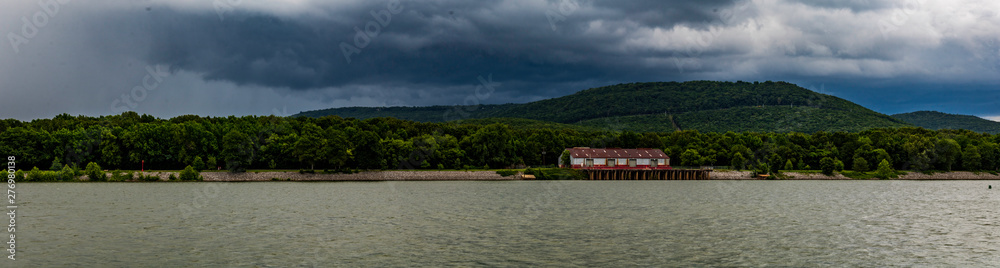 A large boathouse on the river