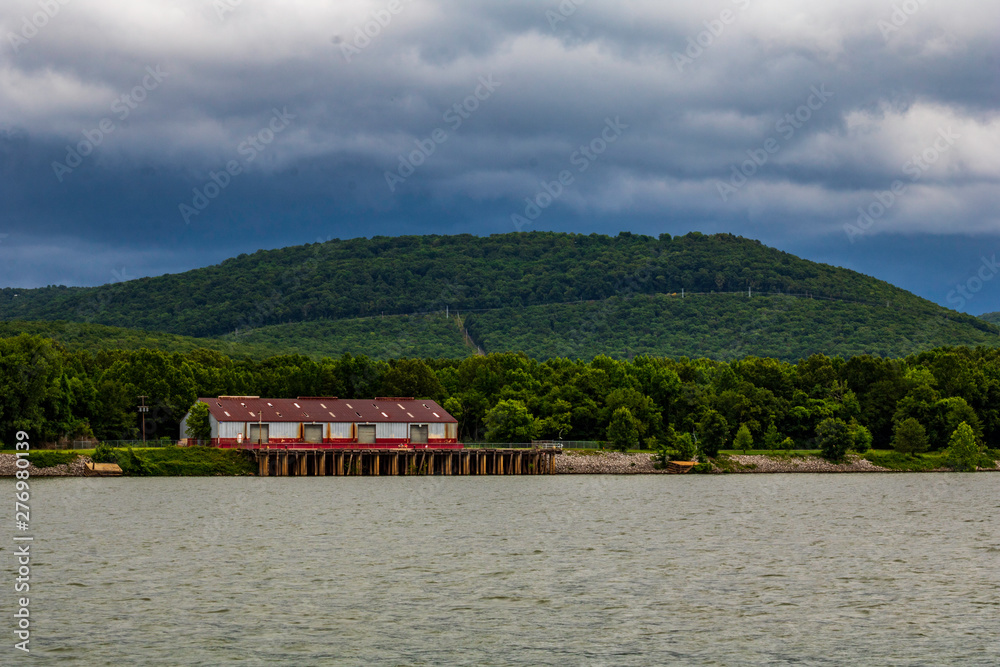 A large boathouse on the river