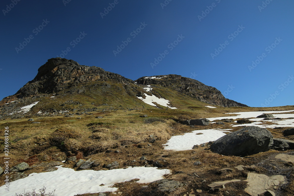 Mountains, grassland and rocks at the valley Karkevagge in Northern Sweden Mountains, grassland and rocks at the valley Karkevagge in Northern Sweden