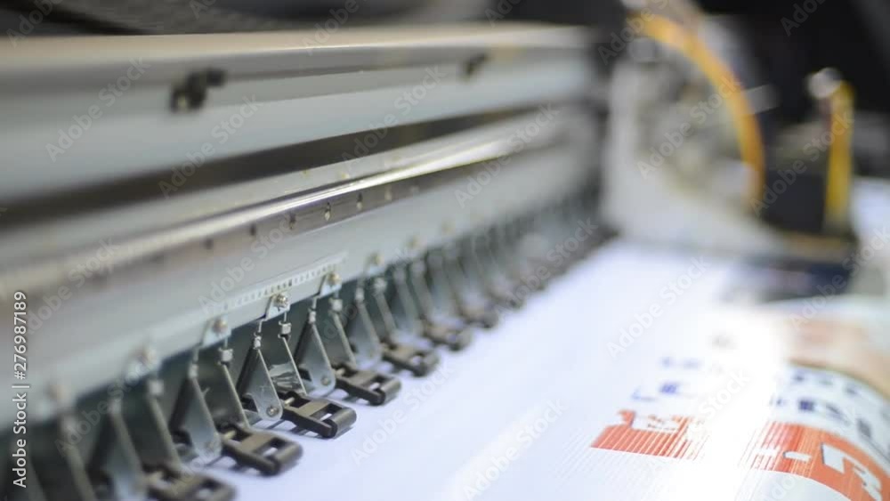 Large format inkjet printing press in operation. Large format inkjet printing press in operation.