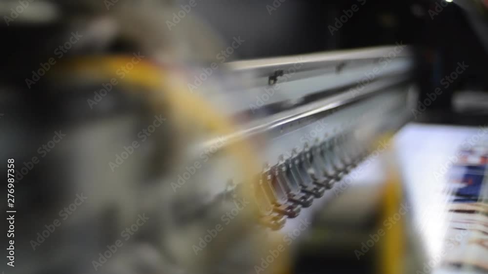 Large format inkjet printing press in operation. Large format inkjet printing press in operation.