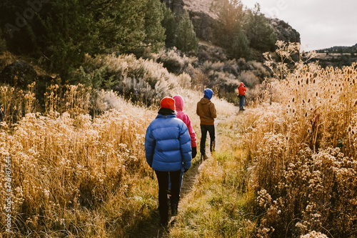 group hiking by a river