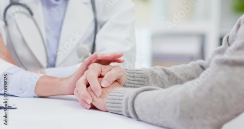 Female doctor console elder patient