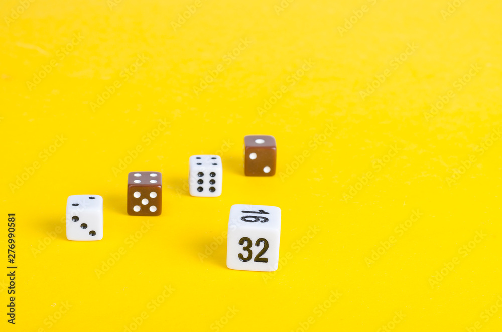 Simple game cubes, dice on bright yellow background. Casino gambling concept Simple game cubes, dice on bright yellow background. Casino gambling concept
