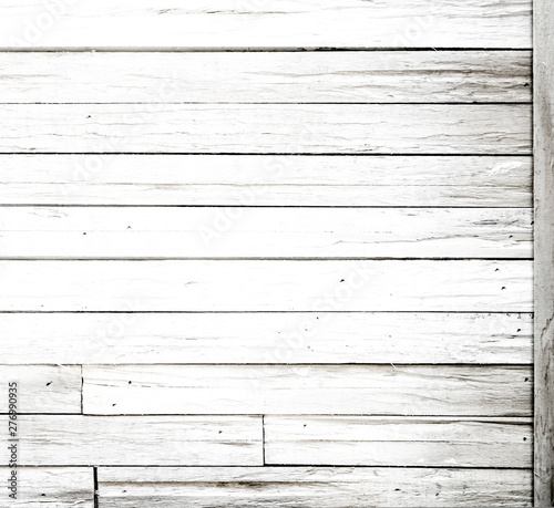 Rustic painted wood wall or floor. Rough wooden planks. Peeling white paint with light neutral flat faded tones.