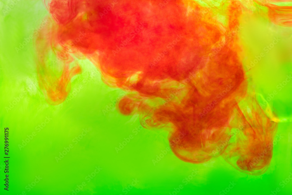 red ink diluted in green water