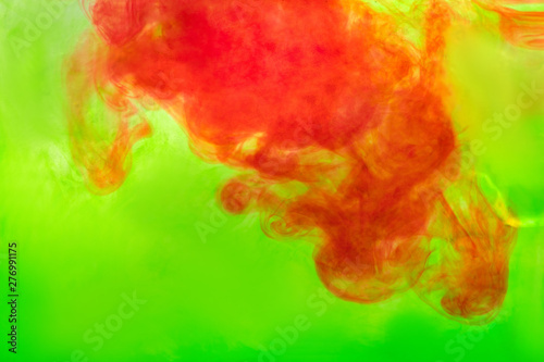 Fototapeta Naklejka Na Ścianę i Meble -  red ink diluted in green water