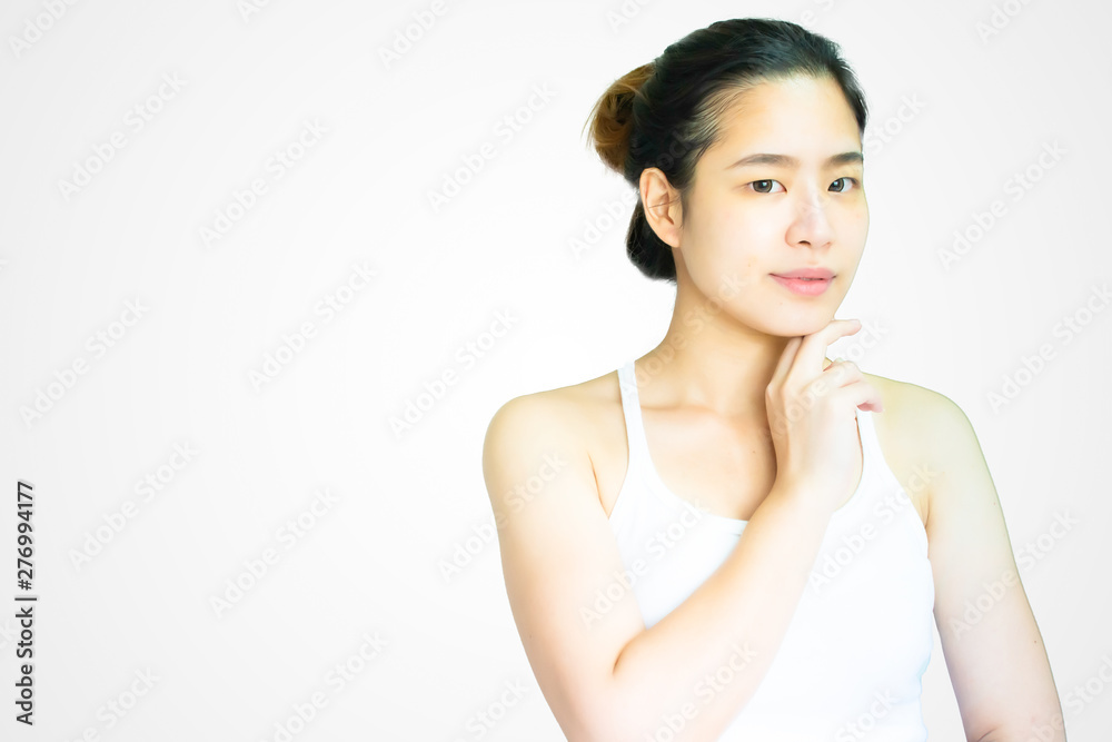 A beautiful asian woman with her skin on white background A beautiful asian woman with her skin on white background