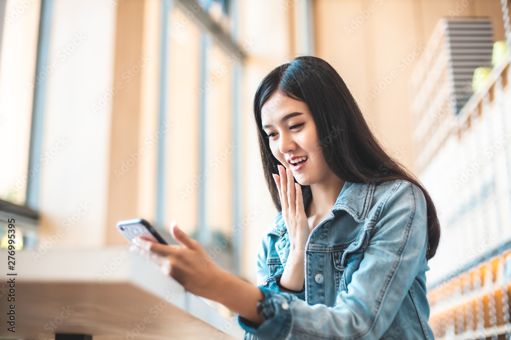 Attractive Asian woman drinking coffee.cheerful girl drinking coffee or tea in morning Attractive Asian woman drinking coffee.cheerful girl drinking coffee or tea in morning