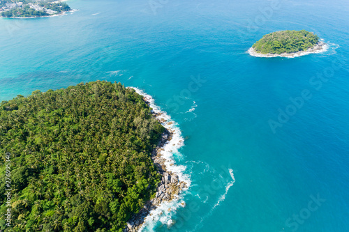 Fototapeta Naklejka Na Ścianę i Meble -  Aerial view of crashing waves on rocks landscape nature view and Beautiful tropical sea with Sea coast view in summer season image by Aerial view drone high angle view