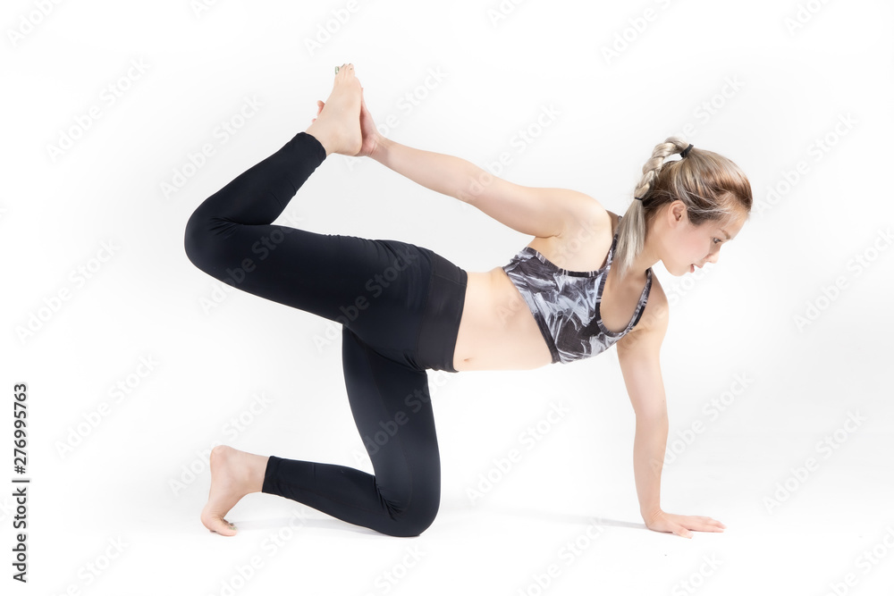 Sporty Asian young woman doing yoga practice isolated on white background. Sporty Asian young woman doing yoga practice isolated on white background.