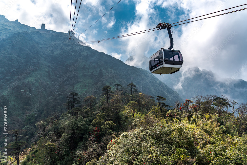 The world's longest electric cable car go to Fansipan mountain peak the highest mountain in Indochina, Backdrop Beautiful view blue sky and cloud in Sapa, Vietnam.