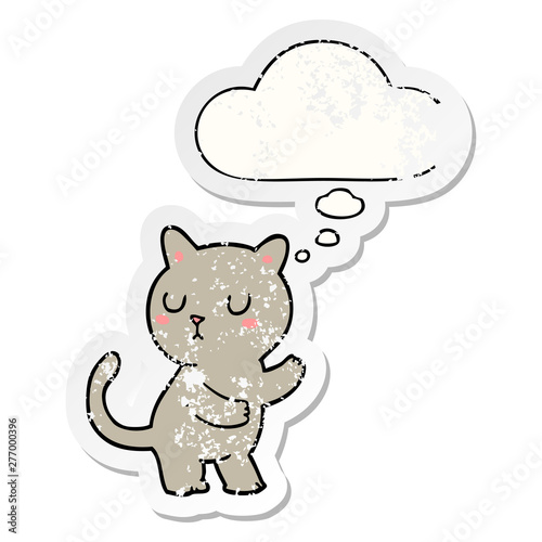 cartoon cat and thought bubble as a distressed worn sticker