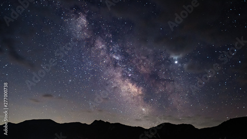 Canvas Print Milky Way over the mountain peaks