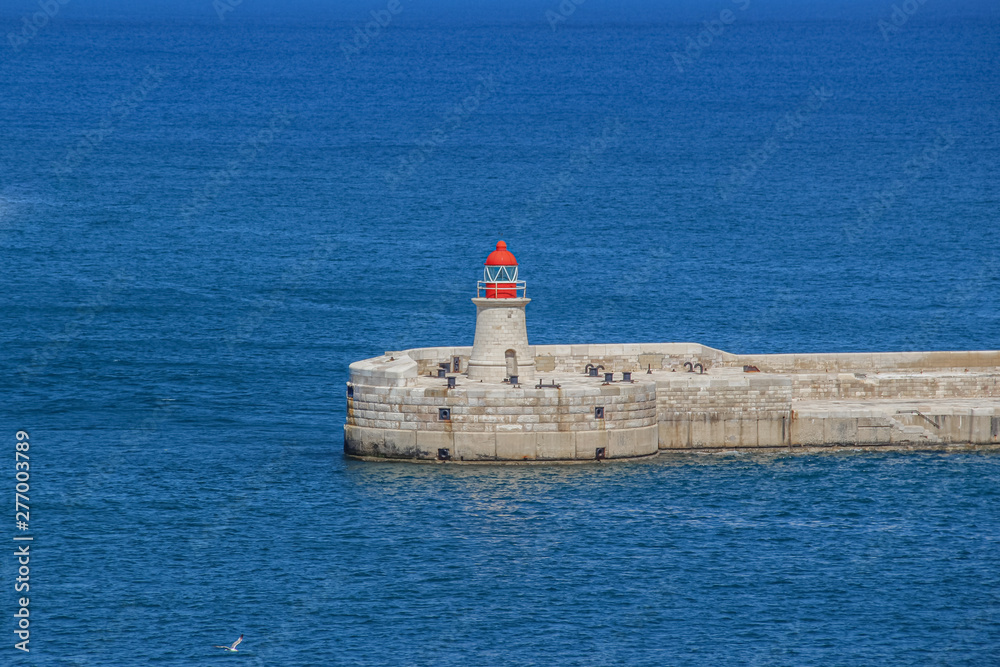 Ricasoli Lighthouse at harbor in Kalkara, near Valletta in Malta.