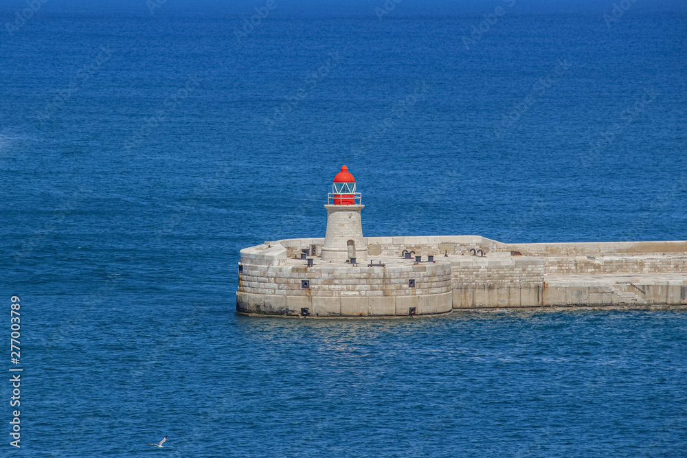 Ricasoli Lighthouse at harbor in Kalkara, near Valletta in Malta. Ricasoli Lighthouse at harbor in Kalkara, near Valletta in Malta.
