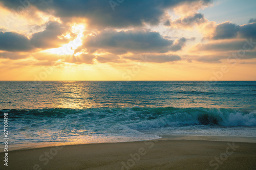 Sunset over the sea. Atlantic ocean in evening, beautiful nature, sandy beach