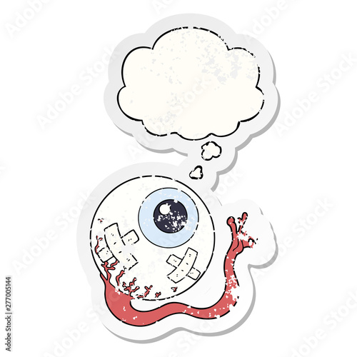 cartoon injured eyeball and thought bubble as a distressed worn sticker