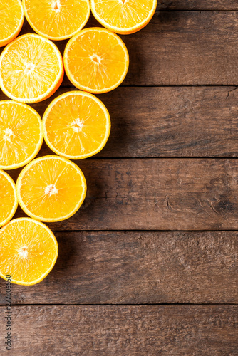 Orange slices on wooden table. Top view